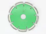 Dinosaw machine showing A durable sintered bond securely holds diamonds, providing superior wear resistance and a lower cost per cut.