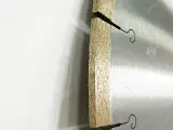 Dinosaw machine showing Optimized bond keeps speed steady on dense tiles.