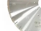 Dinosaw machine showing Bond hardness and geometry balance wear and sharpness to extend service life.