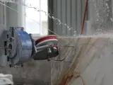 Dinosaw machine showing Cuts through concrete, granite and hard materials at high speed with less effort