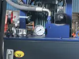 Dinosaw machine showing Automated hydraulic systems replace manual splitting, reducing labor costs by 60%.