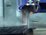 Dinosaw machine showing Encoder-based precise division and infrared laser positioning calibration ensure dimensional accuracy