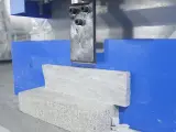 Dinosaw machine showing Grain-following splitting technology maximizes usable stone yield with minimal breakage.