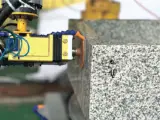 Dinosaw machine showing 6-axis grinding system reaches any angle and position of workpieces