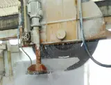 Dinosaw machine showing Horizontal blade coordinates with vertical cutting to complete slab separation automatically